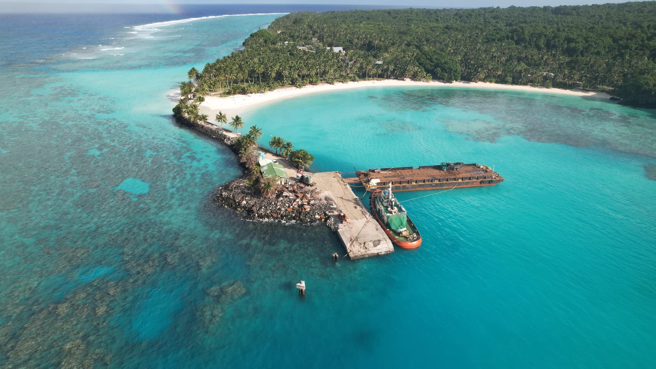 Aerial reef and harbour structure by Croome Photography