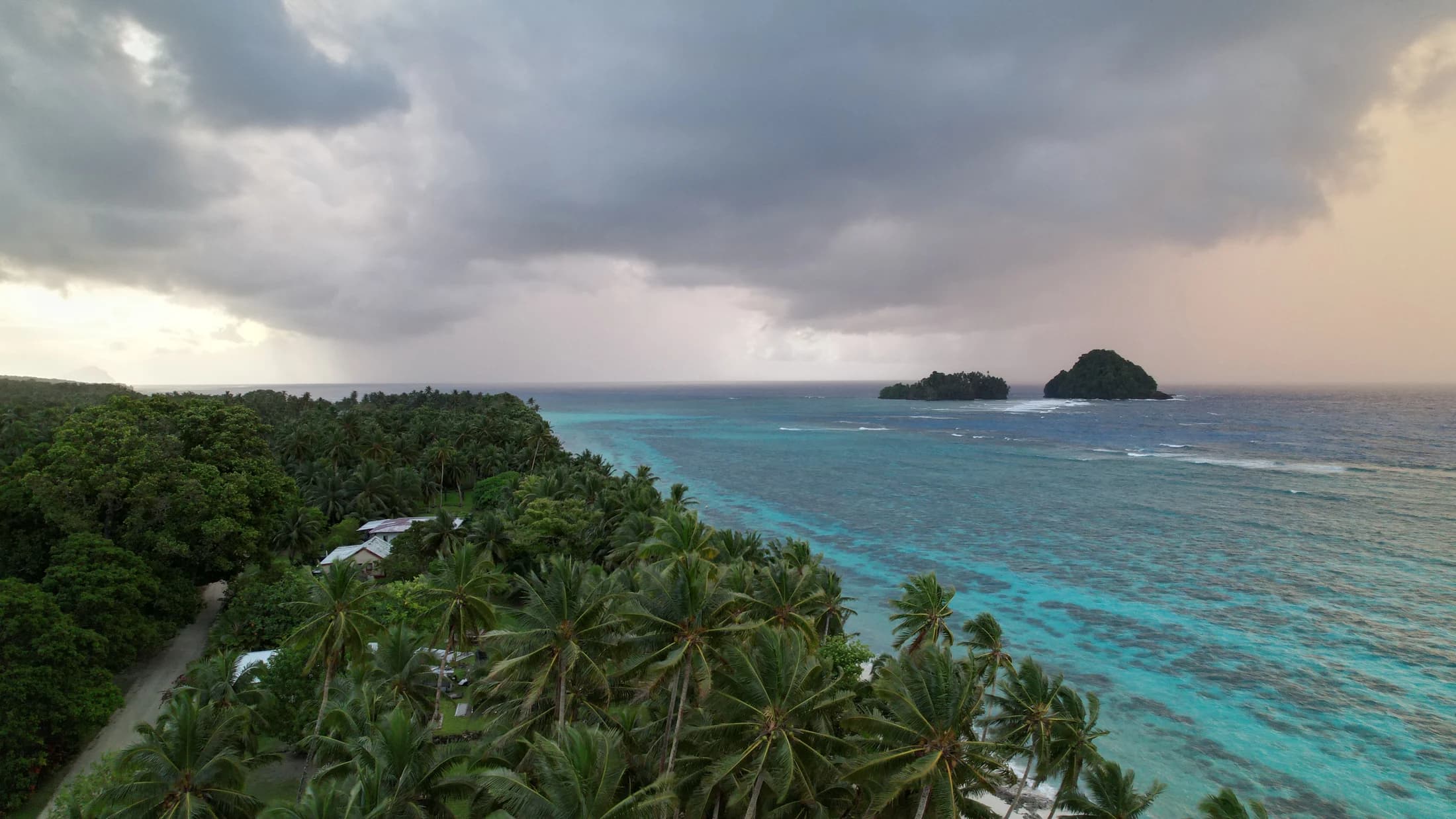 Storm clouds over palm coast and reef by Croome Photography