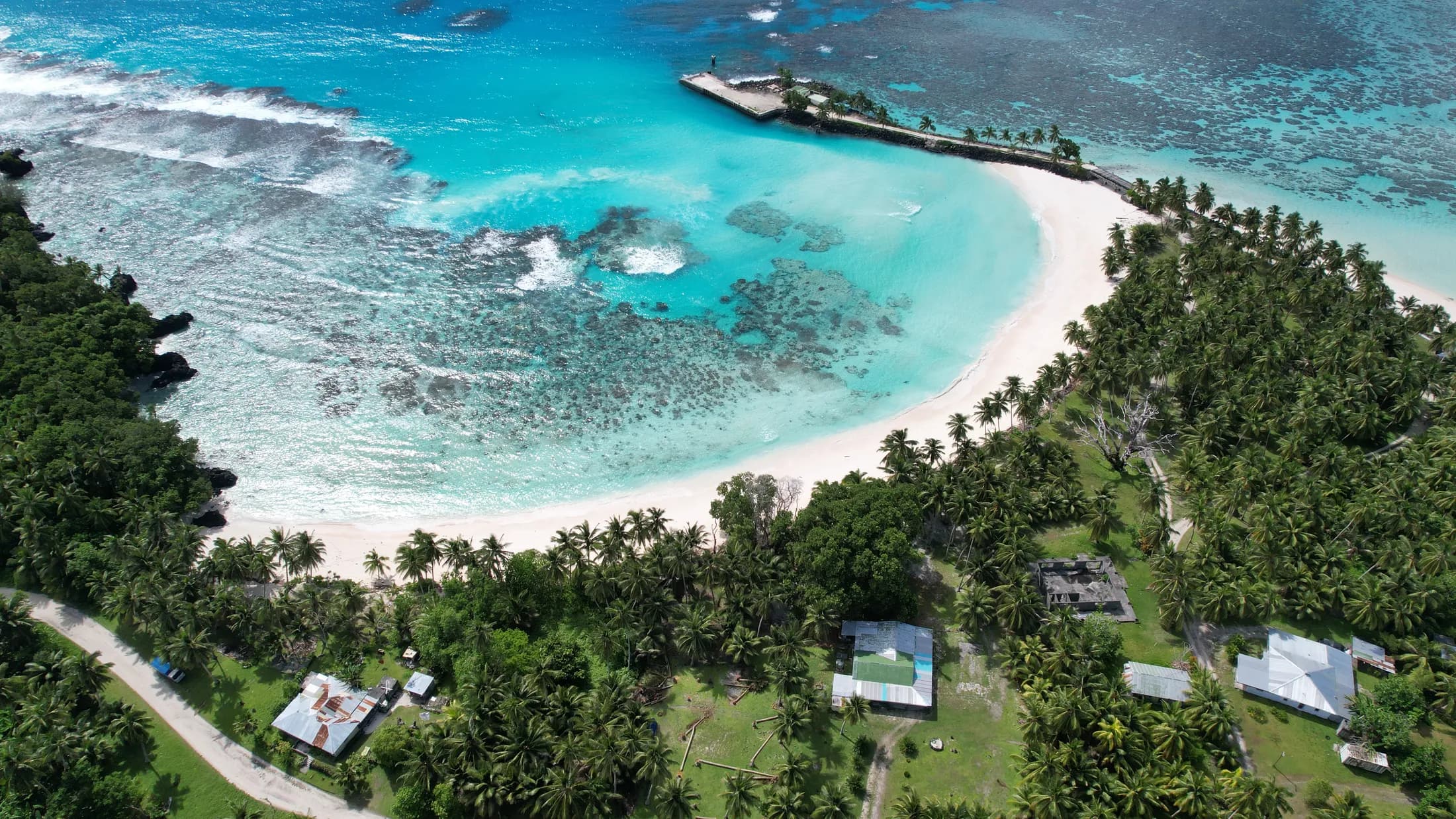 Aerial view of a reef island and clear water by Croome Photography